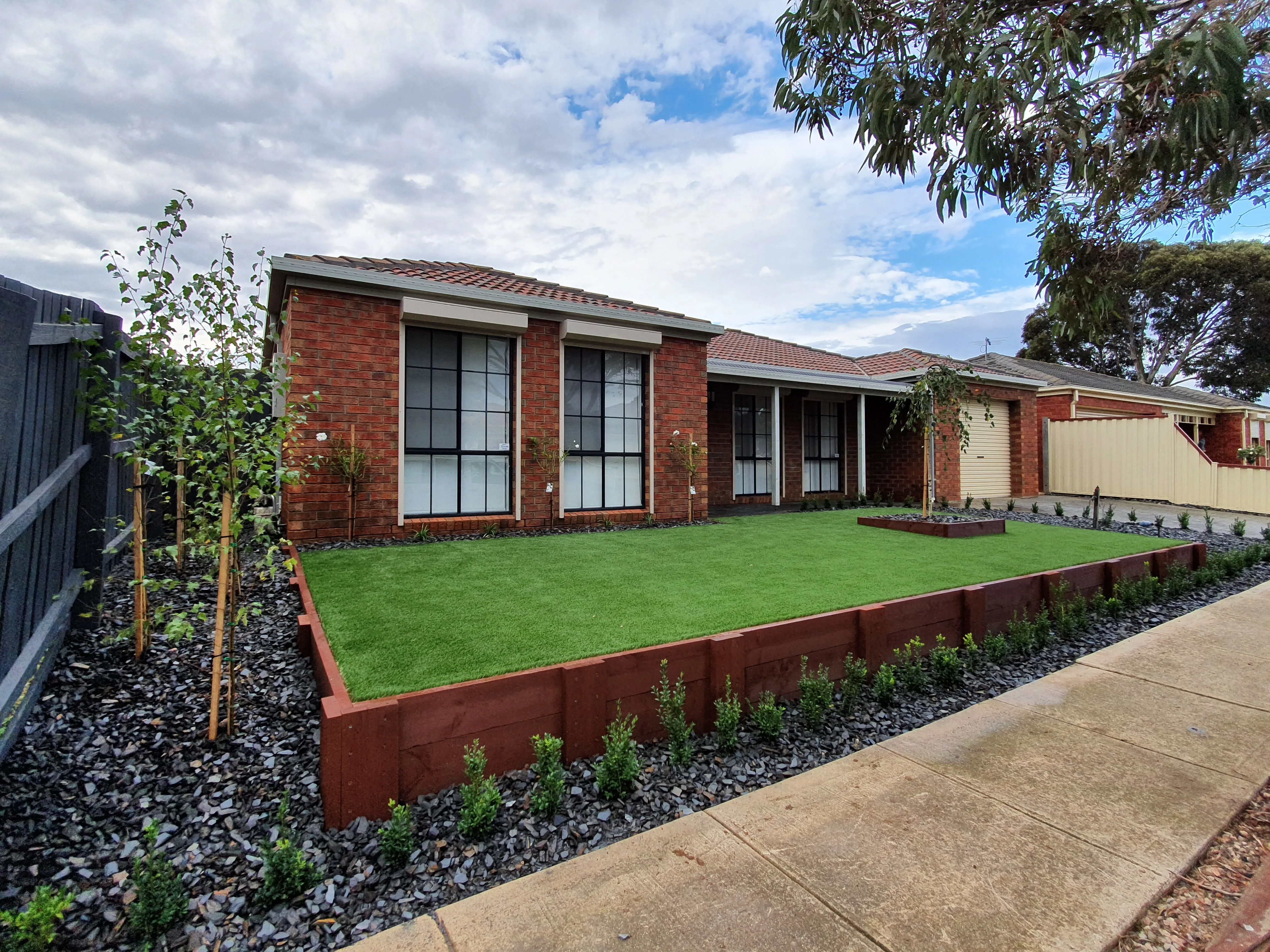 Single-storey brick home with fresh turf and a landscaped front garden — ME BODY Werribee studio exterior